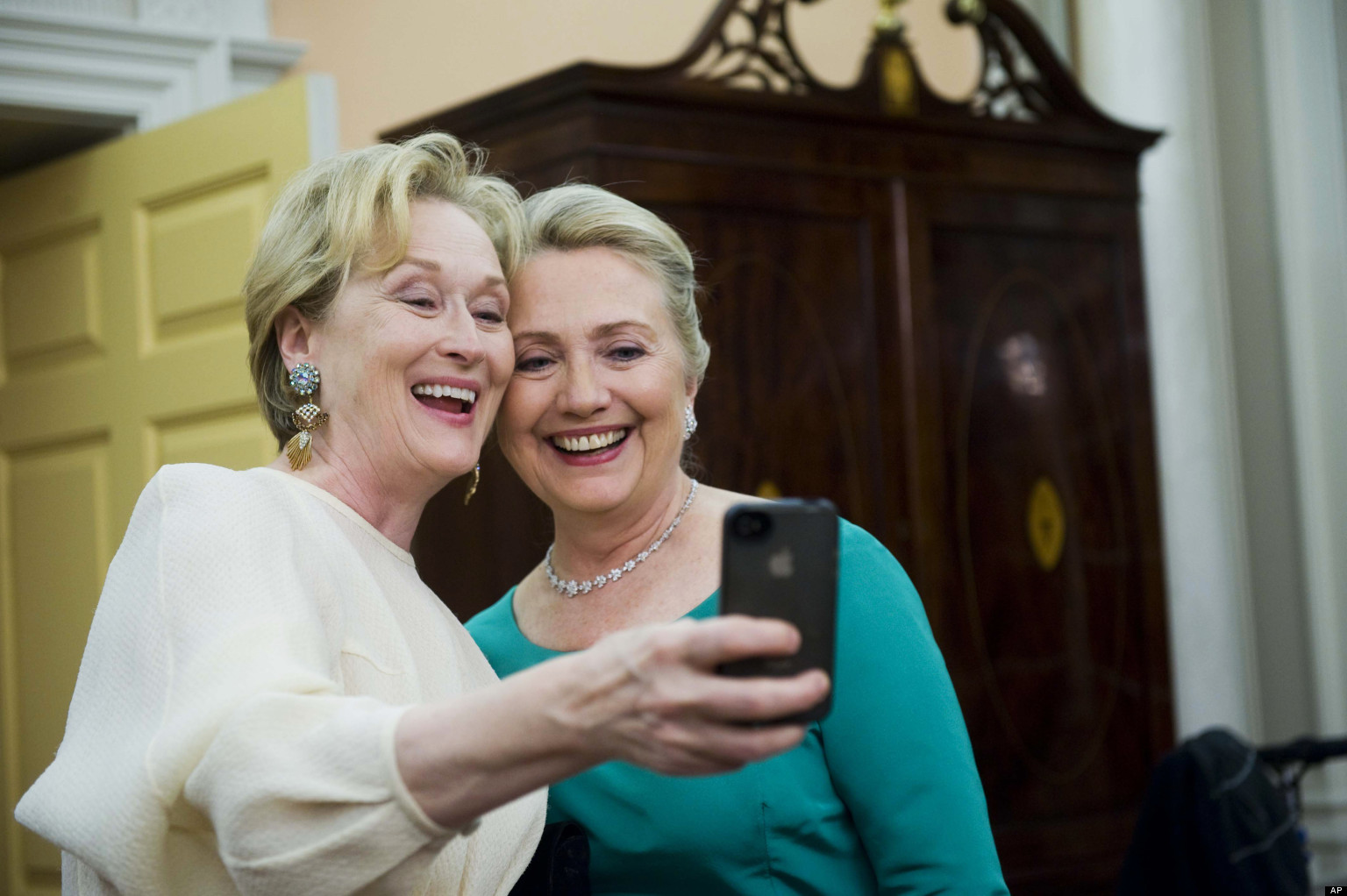 Actress Meryl Streep uses her iPhone to get a photo of her and Secretary of State Hillary Rodham Clinton 
